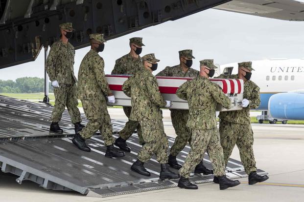 A U.S. Navy carry team transfers the remains of Maxton W. Soviak