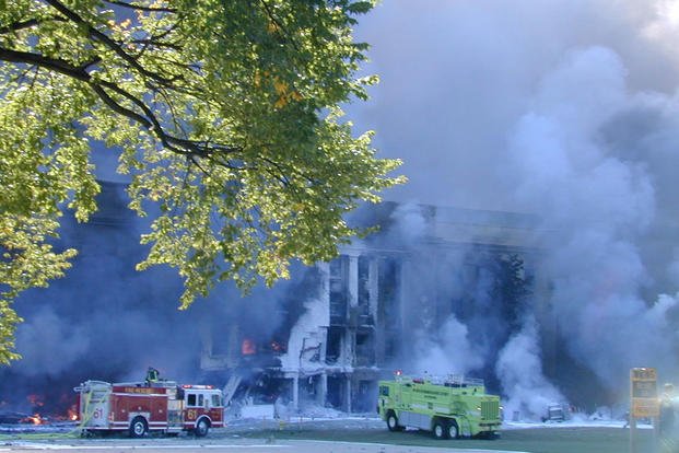 The first fire teams begin working to put out the flames in the minutes after the attack on Sept. 11, 2001