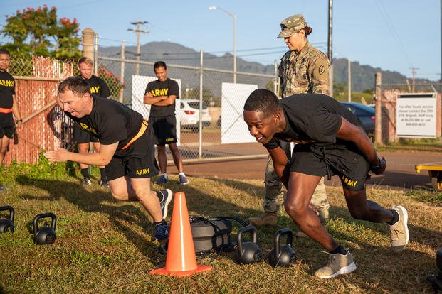 Soldiers perform in the sprint-drag-carry portion of the Army combat fitness test.