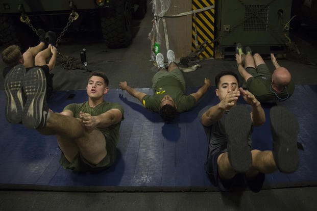 Marines and sailors participate in group training.