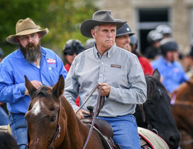 Former Vice President Mike Pence rides on horseback with members of BraveHearts