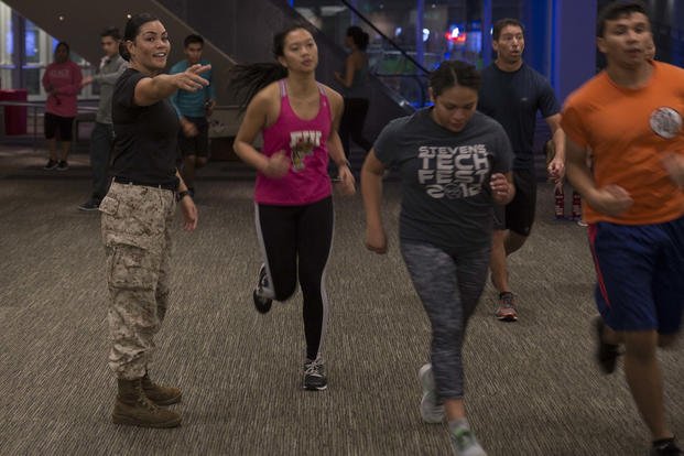 Marines offer motivation during workout.