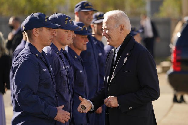 President Joe Biden speaks with members of the coast guard at the U.S. Coast Guard Station Brant Point in Nantucket, Mass.