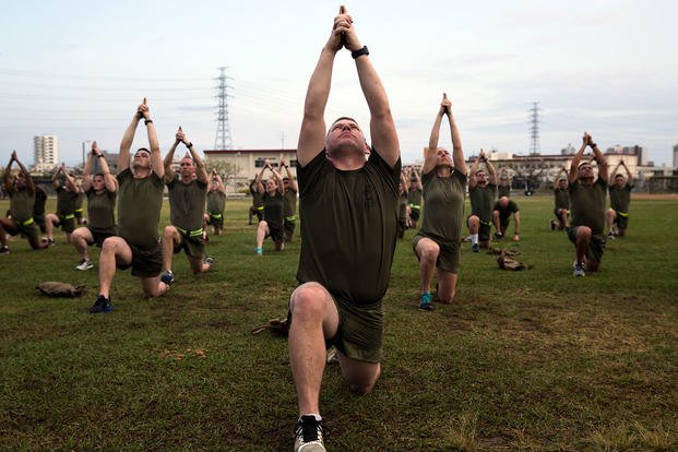 Marines practice yoga on Camp Foster, Okinawa, Japan in 2018. (