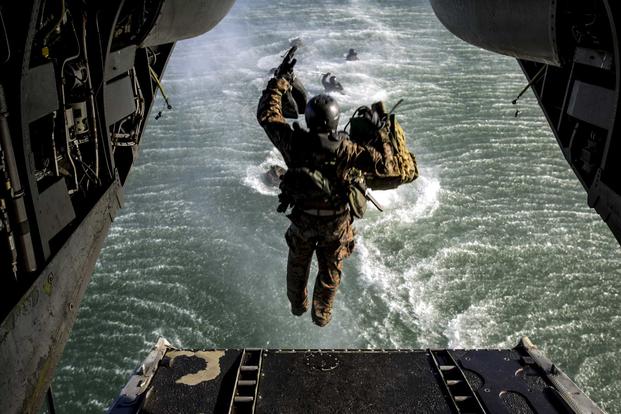Marines and sailors practice their helocasting skills