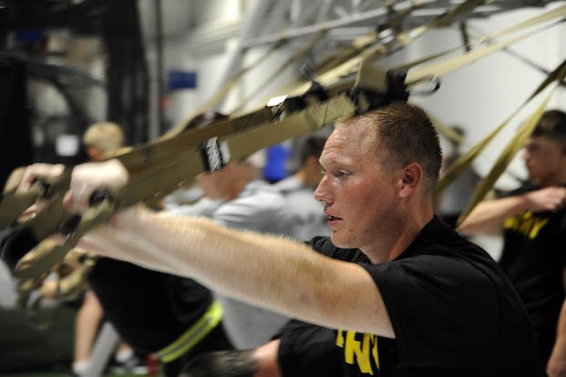 Guardsmen exercise with a TRX suspension system.