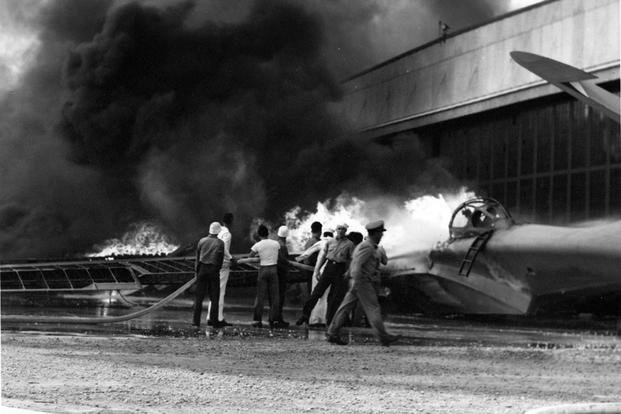 PBY patrol bomber burning at Naval Air Station Kaneohe, Oahu, during the Japanese attack.