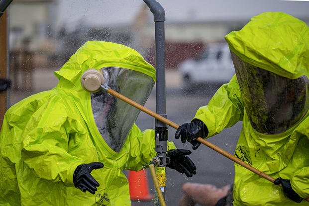 Air Force firefighters practice decontamination steps during a hazardous material exercise at Ali Al Salem Air Base, Kuwait.