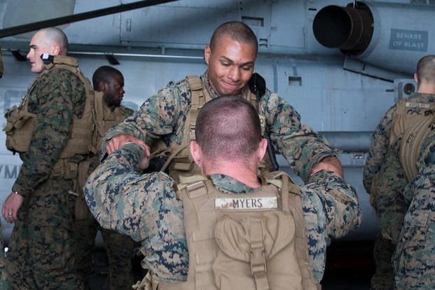 Marines conduct combat life-saving exercises.