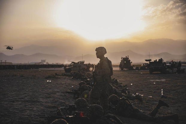 Soldiers assigned to the 10th Mountain Division stand security at Hamid Karzai International Airport, Kabul, Afghanistan, Aug.15, 2021. Soldiers and Marines are supporting the orderly drawdown of designated personnel in Afghanistan.