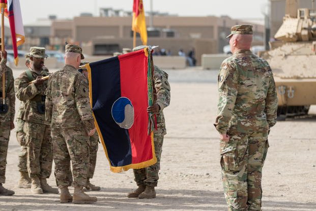 color guard presents their unit’s colors during the 29th Infantry Division’s transfer-of-authority