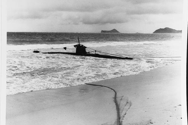 A Japanese Type A midget submarine is beached on Oahu after it went aground following attempts to enter Pearl Harbor.