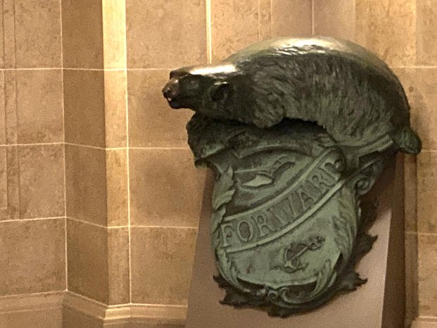 Badger and Shield statue is displayed outside the governor's Capitol office in Madison, Wis.