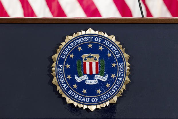 FBI seal on a podium before a news conference 