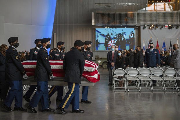 The casket of Lawrence Brooks, who had been the oldest living World War II veteran, is carried at a memorial service.