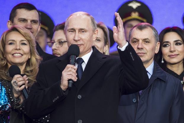 Vladimir Putin at a rally marking the anniversary of annexation of Crimea