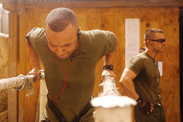 A staff sergeant completes a triceps dip at Forward Operating Base Delhi in Afghanistan.