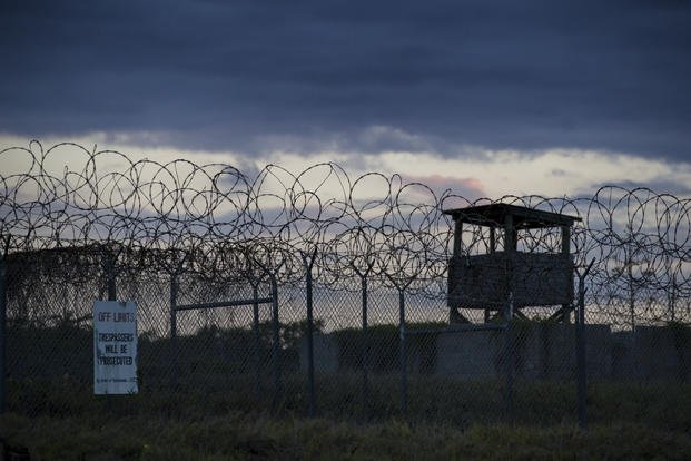 The sun sets behind the closed Camp X-Ray facility in Guantanamo Bay.