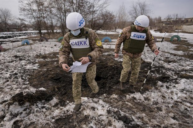 crater from an artillery shell in the Luhansk region, eastern Ukraine