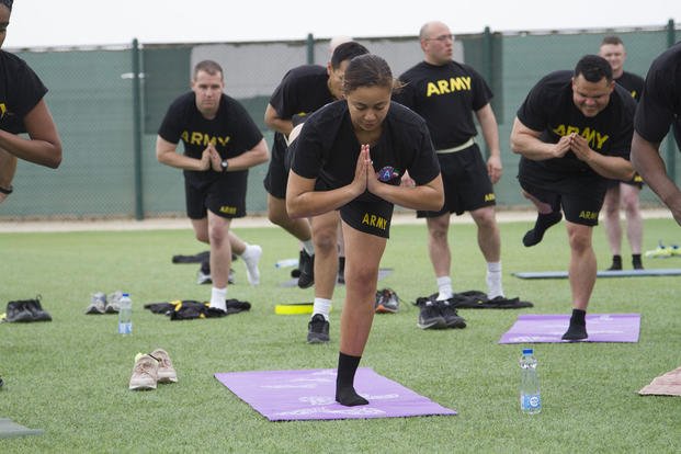 An Army soldier participates in a yoga class at Camp Arifjan, Kuwait.