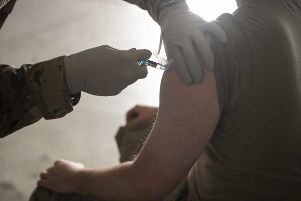 Airman receives a flu vaccine at Joint Base McGuire-Dix-Lakehurst.