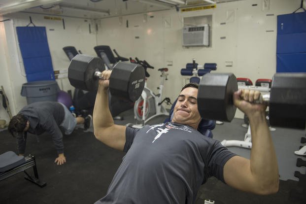 A member of the Coast Guard Law Enforcement Detachment gets in a morning workout.