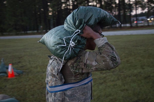 A soldier carries a sandbag at Fort Stewart, Georgia.