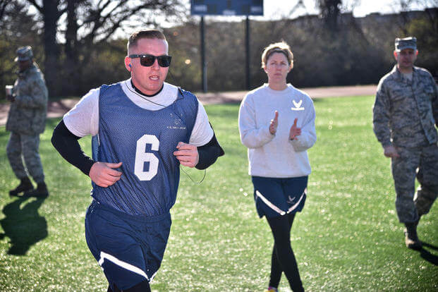 A senior airman completes the 1.5-mile aerobic assessment of the Air Force fitness test.