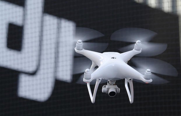 A Phantom 4, developed by major Chinese consumer-drone maker DJI, flies