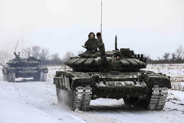 Russian tanks roll on the field during a military drills in Leningrad region.