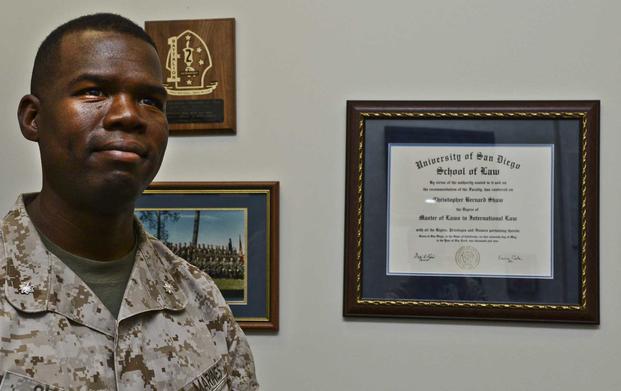 Col. Christopher Shaw poses with his law degree.