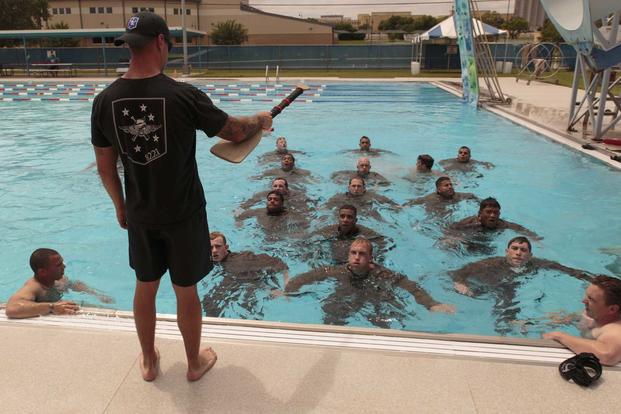 Eric Gilmet instructs sailors during training in 2016.
