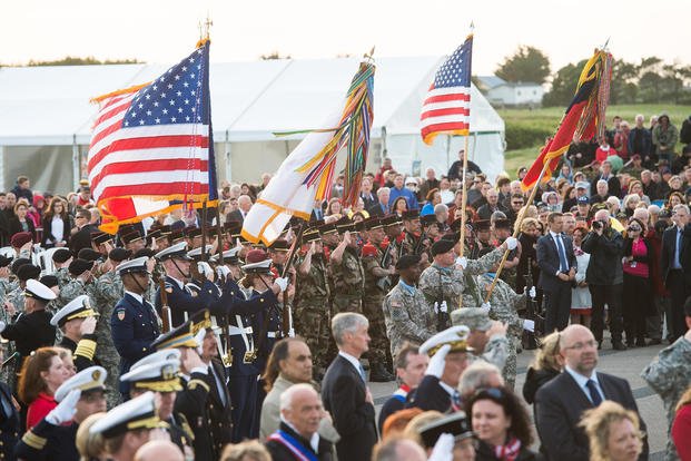 Civilians, U. S. and foreign service members attend the Utah Beach ceremony in Normandy, France, in 2014.