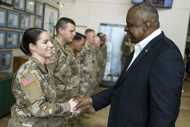 Secretary of Defense Lloyd J. Austin III meets with service members at Fort Carson.