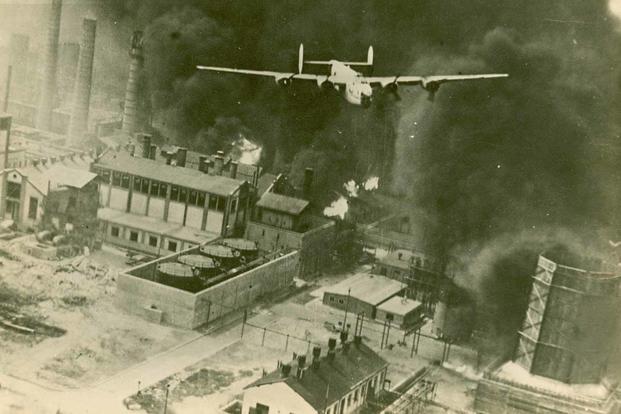 A B-24 over a burning oil refinery in Ploiești, August 1, 1943.