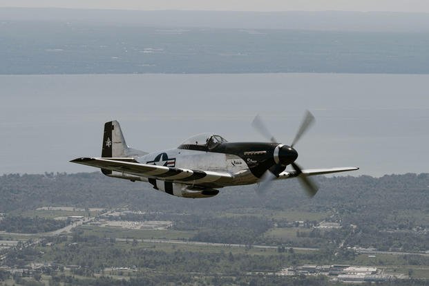 A North American P-51 Mustang flies as part of a Heritage Flight in support of Air Force Reserve Week, Niagara Falls, N.Y.