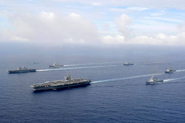 The USS Ronald Reagan and South Korea's ship Marado sail during a joint military exercise.