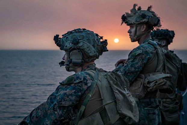 Marines on the USS Arlington stand watch on the Strait of Gibraltar.