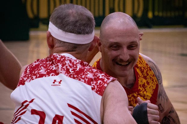 Marine Corps Staff Sgt. Michael Scott competes against Team Canada in wheelchair basketball during the Department of Defense Warrior Games near Orlando, Florida.