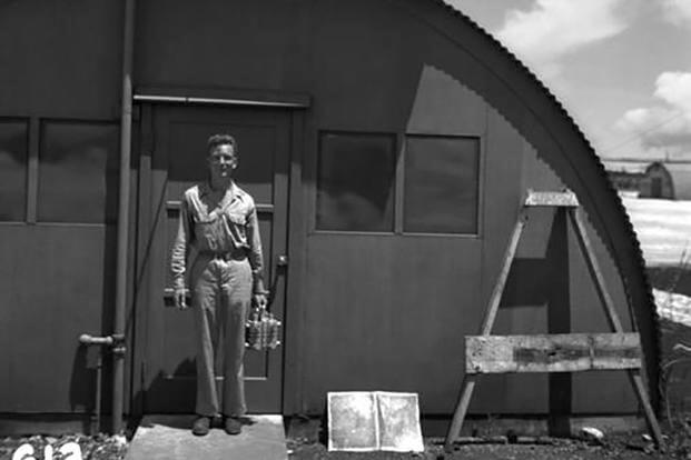 Lawrence Johnston with the Fat Man plutonium core on Tinian in 1945.