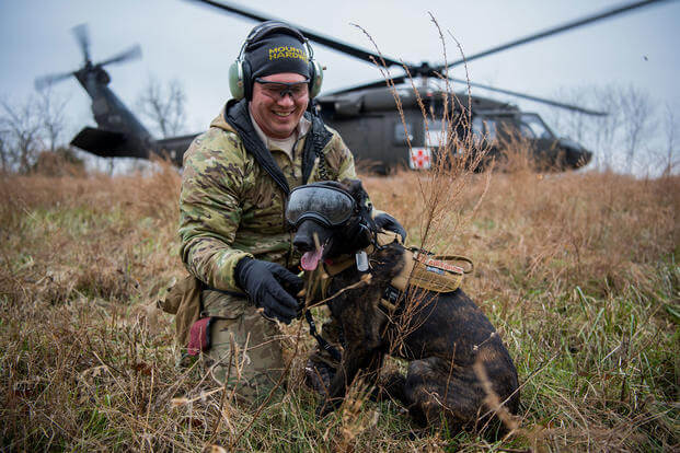Tech. Sgt. Rudy Parsons, a pararescueman with the Kentucky Air National Guard’s 123rd Special Tactics Squadron, and his search and rescue dog, Callie