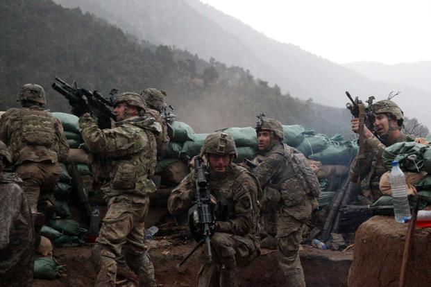 U.S. Army soldiers return fire in Kunar province, Afghanistan.