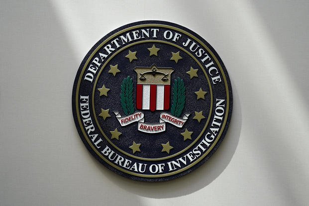 An FBI seal is seen on a wall before the arrival of Director Christopher Wray at a news conference, Wednesday, Aug. 10, 2022, in Omaha, Neb.