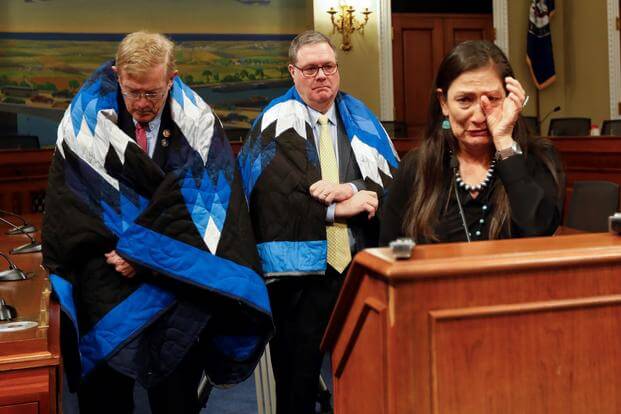Rep. Deb Haaland, Rep. Denny Heck, and Rep. Paul Cook during a news conference.
