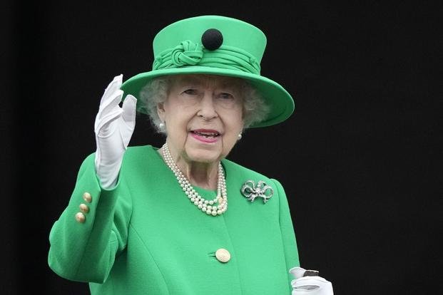 Queen Elizabeth II waves to the crowd during the Platinum Jubilee Pageant.