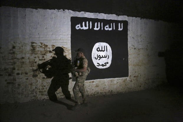 Islamic State group flag, in western Mosul, Iraq.