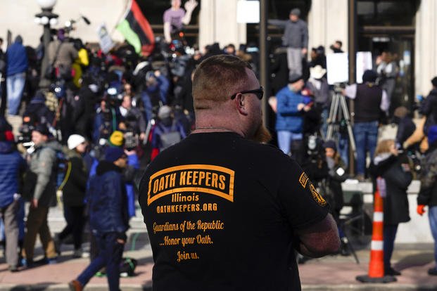 Man wearing Oath Keepers shirt outside the Kenosha County Courthouse.