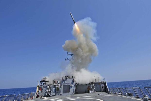 USS Barry launches a Tomahawk cruise missile.