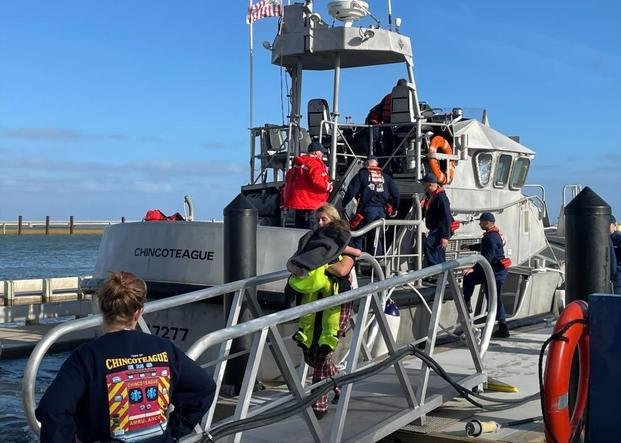 Coast Guard Station Chincoteague transfers 12 people ashore.