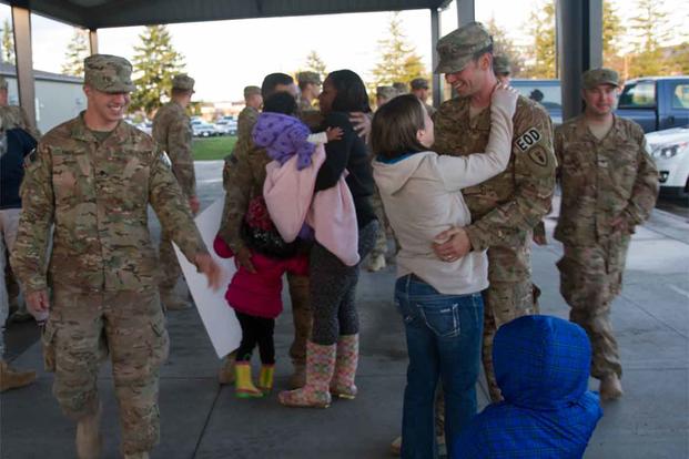 Family and friends gather to welcome home soldiers.